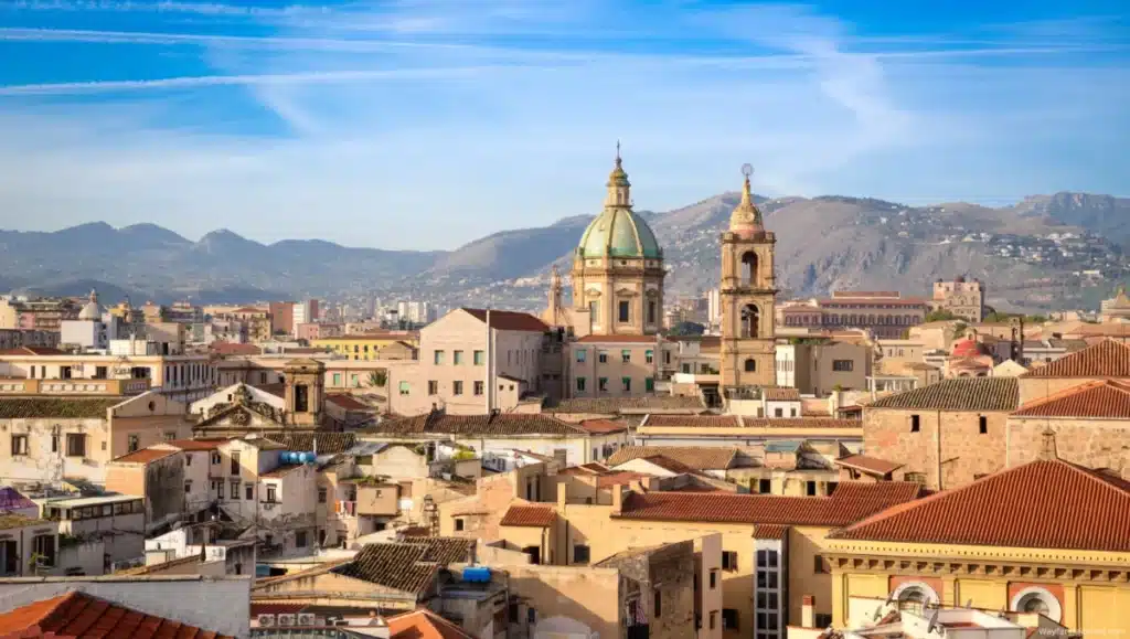 A scenic view of Palermo, Sicily, showcasing historic architecture, vibrant markets, and coastal charm, a Must Visit Cities in Italy